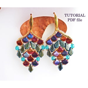 May include: A pair of colourful dangle earrings with a gold-tone metal hook. The earrings feature a cascading design of iridescent blue, purple, red, and gold beads, with small turquoise beads interspersed throughout. The earrings are labelled "TUTORIAL PDF file".