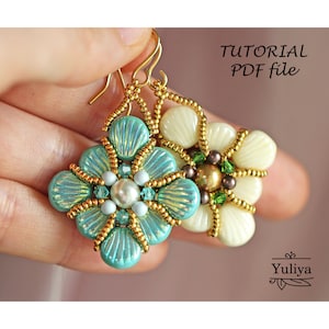 May include: A pair of beaded earrings with a floral design. One earring is teal with gold accents and the other is white with gold accents. The earrings are hanging from gold hooks. The image includes the text "TUTORIAL PDF file".