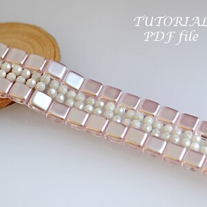 May include: A pink and white beaded bracelet with a square bead pattern. The bracelet is on a wooden surface. TUTORIAL PDF file.