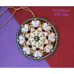 May include: A handmade pendant necklace with a circular design. The pendant features white, cream, and gold beads arranged in a floral pattern, with a green bead at the center. The outer edge is lined with green beads. The text "TUTORIAL PDF file" is visible.