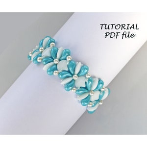 May include: A turquoise and white beaded bracelet with a flower design. The bracelet is made with small, round beads and is on a white surface. The text "TUTORIAL PDF file" is in the upper right corner of the image.