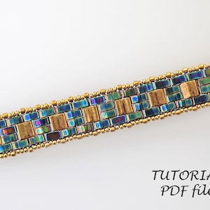 May include: A beaded bracelet with a geometric pattern in shades of blue, green, and gold. The bracelet is made with small seed beads and larger square beads. The image includes the text "TUTORIAL PDF file".
