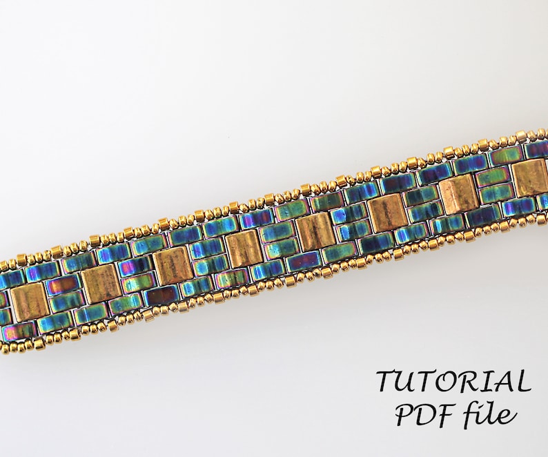 May include: A beaded bracelet with a geometric pattern in shades of blue, green, and gold. The bracelet is made with small seed beads and larger square beads. The image includes the text "TUTORIAL PDF file".