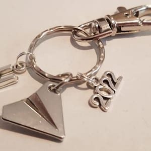 Paper plane shop keyring