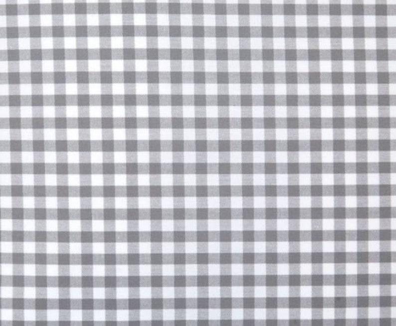 May include: A white and gray gingham fabric with a checkered pattern.