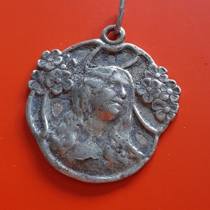 Antique French floral art nouveau silver plated charm of a woman and flowers, female face, art nouveau woman medal pendant