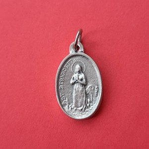 Vintage religious Catholic silver plated oval medal pendant of St Bernadette, Lourdes France, St Bernadette charm