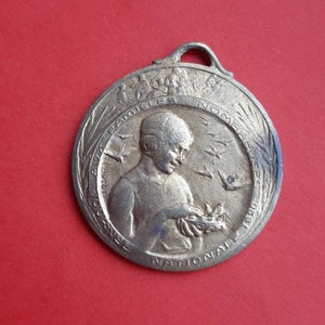 Antique French art nouveau signed brass medal pendant charm of a woman with birds, woman with bird, Journée Nationale medal