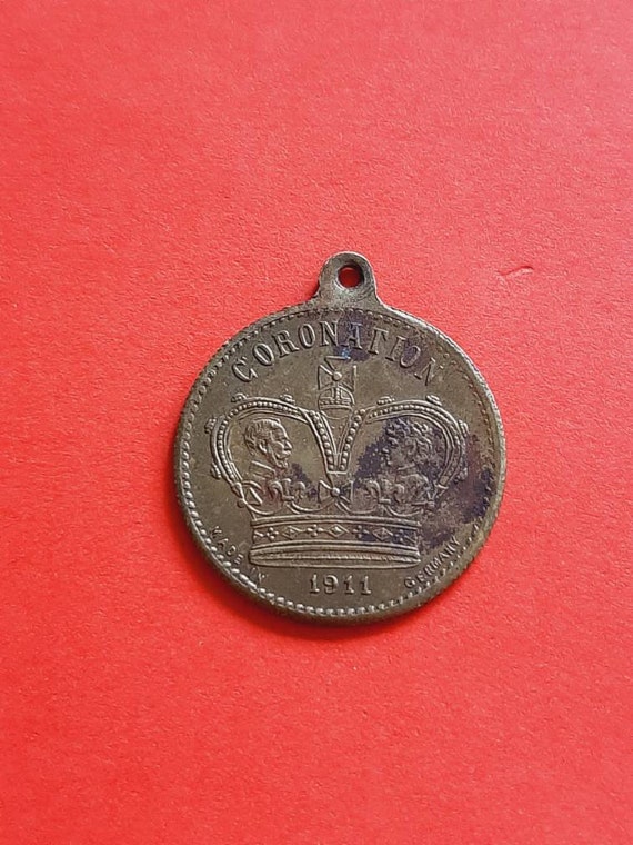 Antique, 1911, brass medal pendant of the Coronati