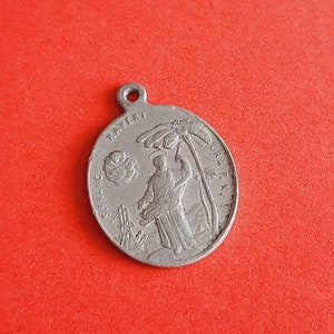 Vintage religious Catholic aluminum medal pendant of The Visionary St. Ignatius of Loyola and the Missionary, St Francis Xavier