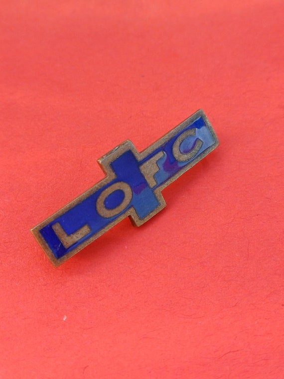 Vintage religious enamel pin of the Labor League o