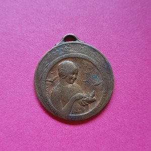 Vintage French art nouveau signed French 1920 bronze art medal pendant of a woman with birds, Journée Nationale, signed PAUTOT