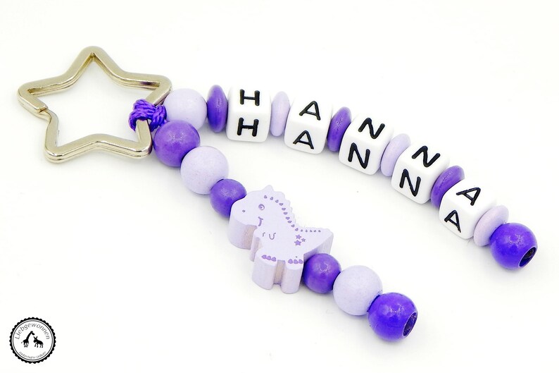 Taschenbaumler/Key fob with wish name-Dino in Lilac/purple image 1