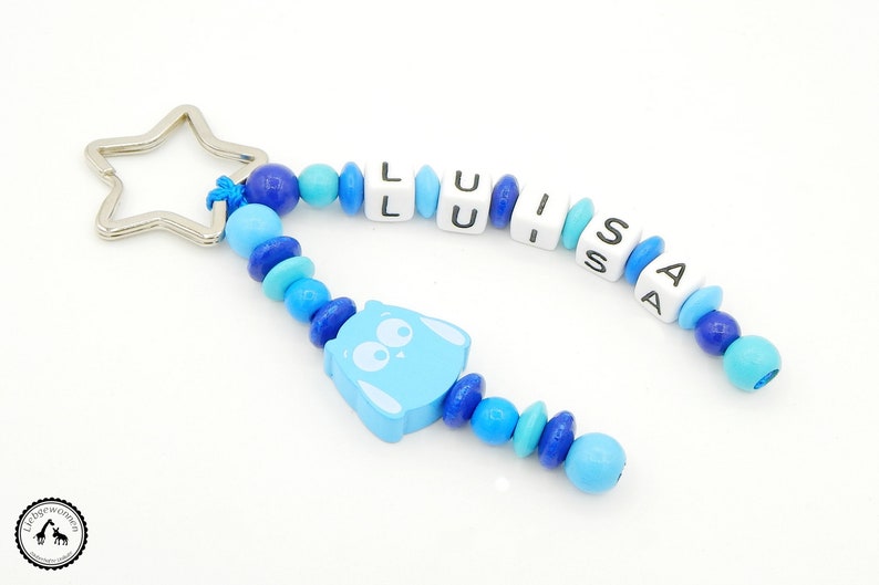 Taschenbaumler/Schlüsselanhänger mit Wunschname Eule in Blautönen Bild 1