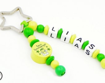 Taschenbaumler/keyring with wish name-guardian angel in green/lemon