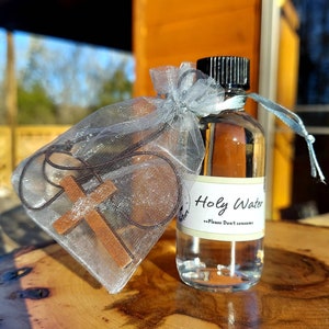 Blessed Holy Water blessed by a Catholic Priest, Free wooden cross pendant