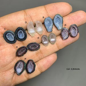 May include: A collection of small, polished agate geode slices labeled 1 through 7, featuring crystalline centers and banded edges in shades of blue, purple, and translucent white, with the text 16-13mm visible in the lower right corner.
