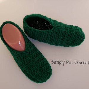 May include: A pair of green crocheted slippers. The slippers are made with a simple stitch and have a soft, comfortable feel.  Simply Put Crochet.