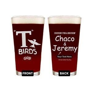 May include: Two red beer glasses with white text. The glass on the left says "T-Birds" with a bird graphic and "Grease" logo. The glass on the right says "Cruisin' for a Bruisin' Chaco & Jeremy" with a space for personalized text.
