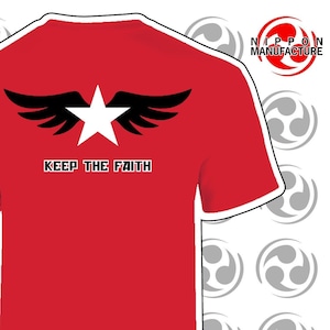 May include: Red t-shirt with a white star and black wings graphic. The text "KEEP THE FAITH" is printed below the graphic.
