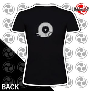 May include: Black women's t-shirt with a silver graphic of a stylized record on the front. The text "NIPPON MANUFACTURE" is in the top right corner of the image.