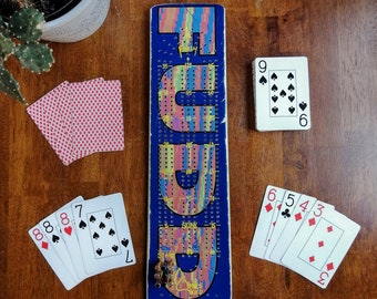 Unique Ski Cribbage Board, comes with 9 metal pegs and a deck of cards.