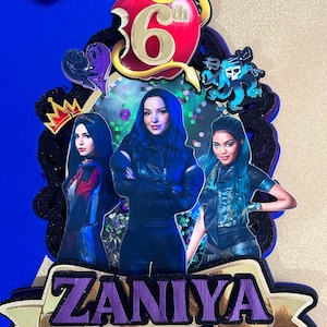 May include: A purple and gold cake topper featuring a red apple, the number 6, and the words "Zaniya" and "6th". Three characters from the Disney film Descendants are depicted on the topper.