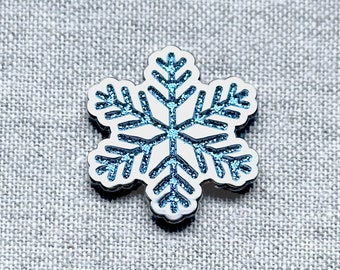 Glitter Snowflake enamel pin – Let it snow with a sparkly snowflake pin! Pretty blue glitter, a perfect winter accent! Cute stocking stuffer