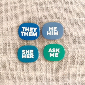 Pronoun enamel pins — He/Him, She/Her, They/Them…Ask Me! Let others know your preference with our unique designs! Pronoun gift, gender gift.