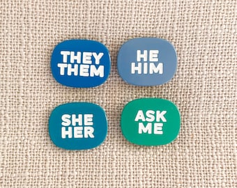 Pronoun enamel pins — He/Him, She/Her, They/Them…Ask Me! Let others know your preference with our unique designs! Pronoun gift, gender gift.