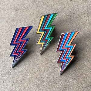 Lightening Bolt Fashion enamel pin – Up your accessory game with this bold enamel pin! Multiple colors - even Chicago Cubs colors! Cool gift