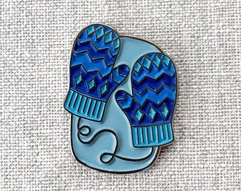 Blue Mitten enamel pin – You'll always have a pair of mittens with this cute wintry design! A perfect winter accent! Cute stocking stuffer