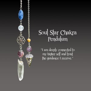 May include: A Soul Star Chakra pendulum featuring a clear quartz crystal and assorted gemstone beads in blue, purple, and yellow. The pendulum hangs from a silver chain and has decorative metalwork. The image includes the text: "I am deeply connected to my higher self and trust the guidance I receive."