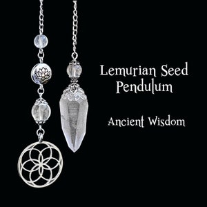 May include: Two silver-toned pendulums with clear crystal and decorative accents hang against a black background. One features a clear crystal point, while the other has a clear crystal sphere and a silver lotus charm. Text reads "Lemurian Seed Pendulum" and "Ancient Wisdom."