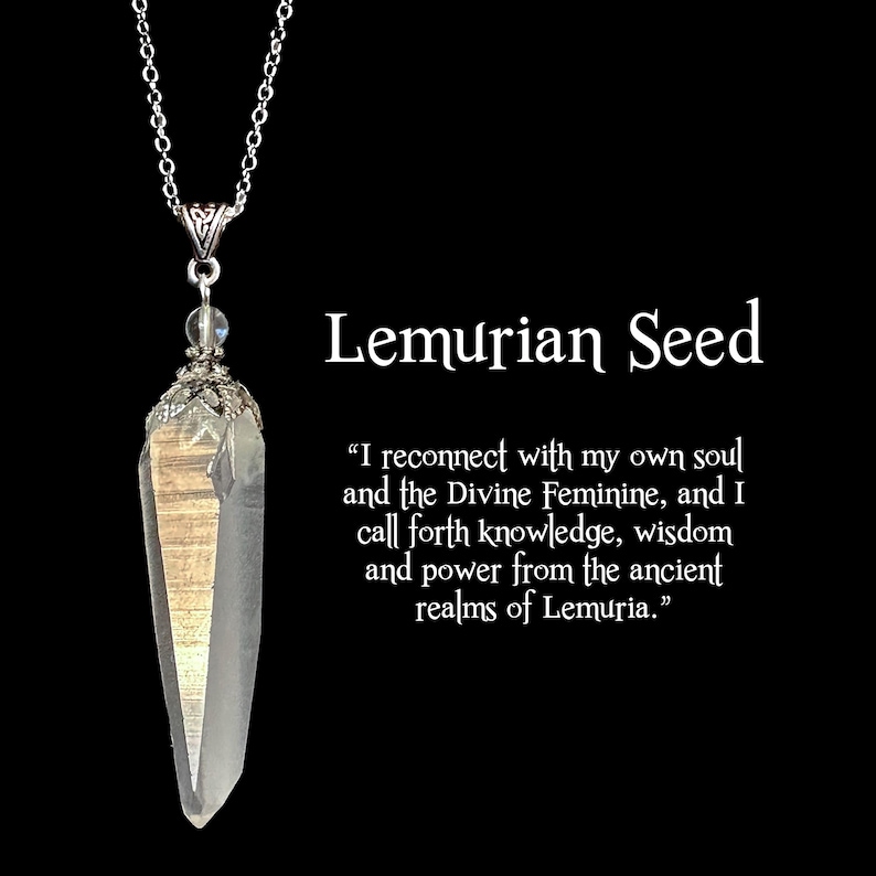May include: A clear quartz crystal pendant with a silver chain. The crystal is elongated with a pointed tip and a silver cap. The text "Lemurian Seed" is displayed with a quote about connecting with the soul.