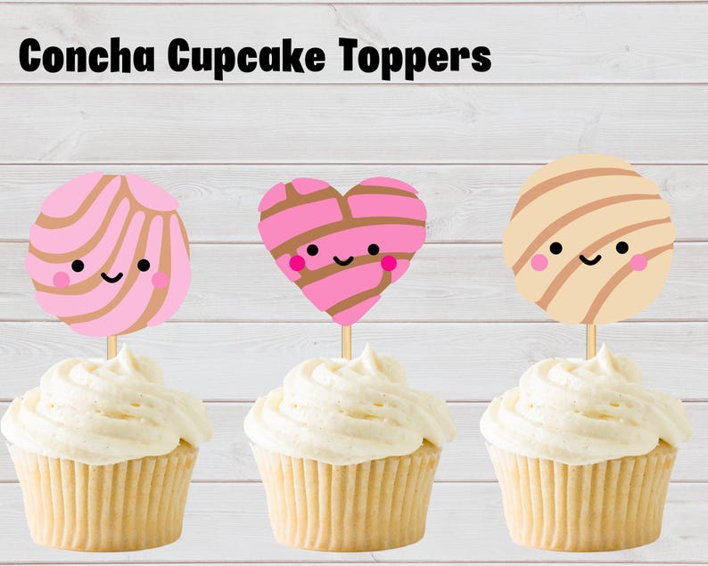 May include: Three cupcake toppers labeled Concha Cupcake Toppers. The toppers feature cartoon concha bread designs: a round pink one, a heart-shaped pink one, and a round beige one, all with smiling faces and brown striped patterns on wooden sticks.