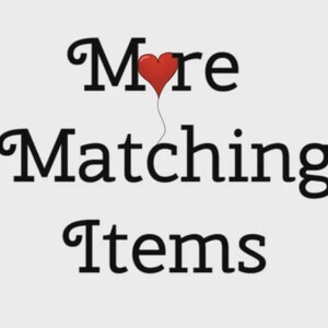 Puede incluir: Imagen con el texto "More Matching Items" en una fuente negra y elegante. Un globo rojo en forma de coraz&oacute;n flota sobre la palabra "More". El fondo es de color gris claro.