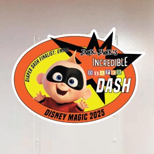 May include: A yellow and orange oval sticker with a black star and the text "Jack-Jack's Incredible Diaper Dash" and "Disney Magic 2025". A cartoon image of baby Jack-Jack from the Incredibles movie is in the center of the sticker.