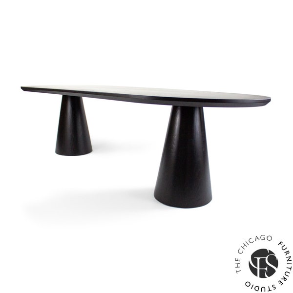 Pedestal base pill shaped dining table