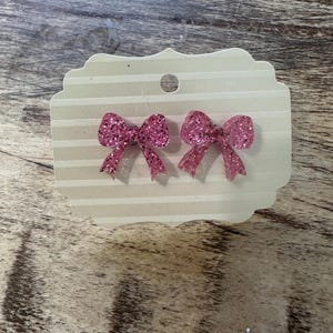 Acrylic light pink glitter bow stud earrings nickel free lead free posts