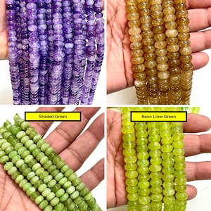 Op de afbeelding: Vier strengen met ronde, schijfvormige kralen in verschillende kleuren. De streng linksboven is gelabeld als Amethyst Quartz in paars, rechtsboven als Golden honey quartz in amber, linksonder als Shaded Green en rechtsonder als Neon Lime Green.