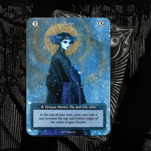 May include: A fantasy trading card with a blue and gold colour scheme. The card features an illustration of a woman named Aino, with the text "A Unique Mortal, the last one alive." The card design includes a sunburst pattern and the artist's signature.