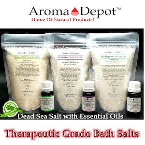 May include: Three bags of white Dead Sea bath salts with essential oils. The bags are labeled Spearmint, Lavender, and Eucalyptus. Each bag has a small bottle of essential oil next to it. The text "Dead Sea Salt with Essential Oils" and "Therapeutic Grade Bath Salts" is displayed below the bags.