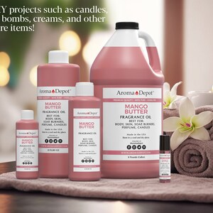 May include: Five bottles of Mango Butter Fragrance Oil in various sizes, from a small 10 ml bottle to a large 1 gallon jug. The bottles are all pink and have a white label with the text "Aroma Depot" and "Mango Butter Fragrance Oil". The bottles are arranged on a table with a pink towel and a white candle.