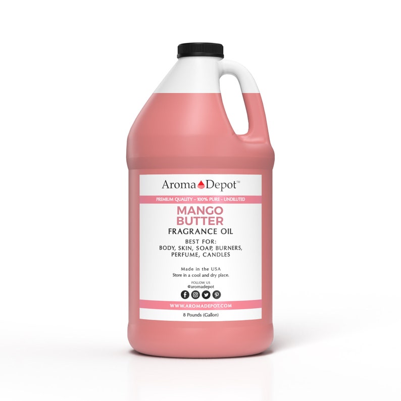 May include: A gallon jug of pink Mango Butter Fragrance Oil from Aroma Depot. The label says "Premium Quality - 100% Pure - Undiluted" and lists uses for the oil, including body, skin, soap burners, perfume, and candles. It also says "Made in the USA" and "Store in a cool and dry place".