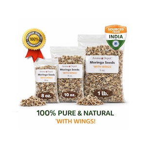 May include: Three clear plastic bags of Moringa seeds, labeled with weights of 8 oz, 10 oz, and 1 lb. The bags are labeled "Aroma & Depot Moringa Seeds 'WITH WINGS'". A gold seal reads "Premium Quality 100% Guaranteed". The text "100% Pure & Natural" is also visible.