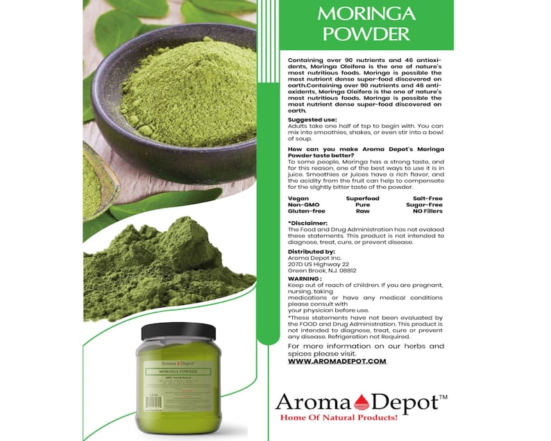 May include: A green jar of Moringa Powder with a white label that reads "Aroma Depot Moringa Powder". The label also includes the text "Home of Natural Products!" and a logo of a red heart with a green leaf. The jar is sitting on a wooden surface.