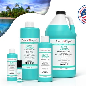 May include: A collection of turquoise fragrance oil bottles and a large jug with the text "BUTT NAKED FRAGRANCE OIL." The bottles vary in size and include the text "BEST FOR: BODY, SKIN, SOAP BURNERS, PERFUME, CANDLES." An "American Product Made in USA" seal is visible.