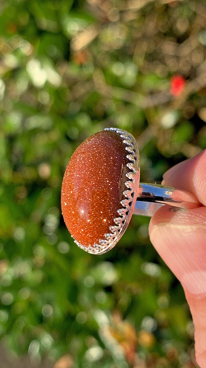 Goldstone oval cabochon sterling silver ring size 7 medium iridescent eye-catching sparkles highly polished elegant custom silver work