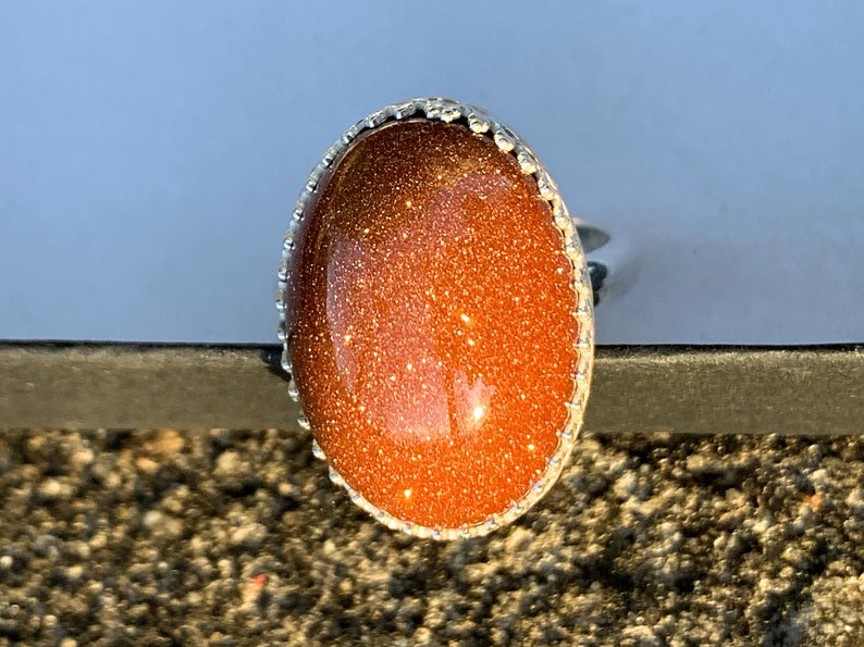 Goldstone oval cabochon sterling silver ring size 7 medium iridescent eye-catching sparkles highly polished elegant custom silver work